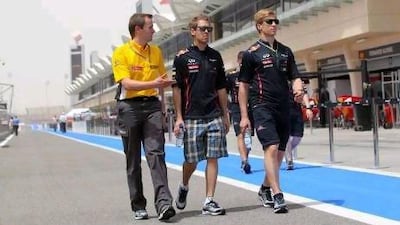 Sebastian Vettel, centre, is looking forward to getting on with the job of driving his Red Bull Racing car in practice in Bahrain.