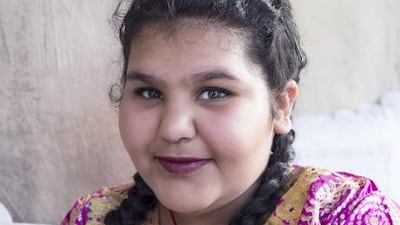 An Emirati girl in traditional dress at the Qasr Al Hosn Festival. Reem Mohammed / The National