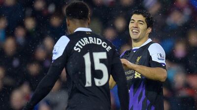 Luis Suarez is happy at how things have shaped up at Liverpool. Andrew Yates / AFP