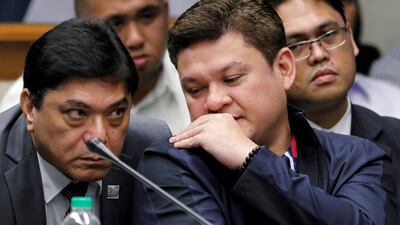Paolo Duterte, son of president Rodrigo Duterte, talks to his lawyer during a Senate hearing on drug smuggling in Pasay, Metro Manila, Philippines, on September 7, 2017. Erik De Castro / Reuters