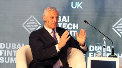 Bill Winters, chief executive of Standard Chartered, speaks at the Dubai FinTech Summit on Monday. Pawan Singh / The National