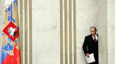 Putin enters for his annual press conference in Moscow on January 31, 2006. AFP