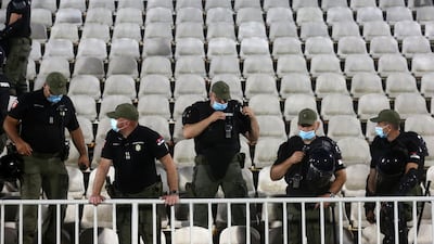 Police wearing face masks at the Partizan Stadium in Belgrade. AFP