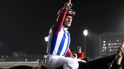 Jockey Mirco Demuro celebrates victory in the Dubai World Cup on Japanese horse Victoire Pisa