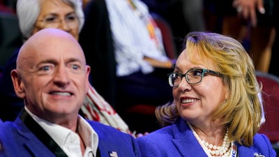 Gabby Giffords, former US representative from Arizona, and Senator Mark Kelly of Arizona appear at the DNC. Bloomberg