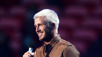 David Beckham, with bleached locks and a brown leather jacket, presents on stage at the Concert for Diana at Wembley Stadium on July 1, 2007 in London, England. Getty Images