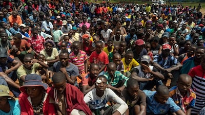 Survivors listen to Zimbabwe's President Emmerson Mnangagwa addressing residents of Ngangu, a township of Chimanimani during his tour of the affected areas. AFP