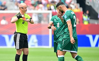 Referee Anthony Taylor shows a red card to Rebin Sulaka of Iraq (R) during the FIFA World Cup 2026 group stage match Senegal against Iraq, in Toronto, Canada, 26 June 2026. EPA / EDUARDO LIMA