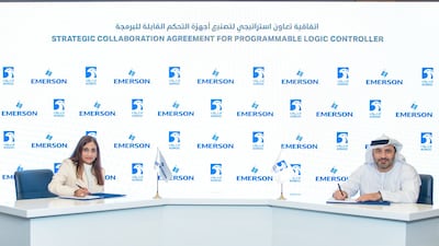 Vidya Ramnath of Emerson, left, and Saleh Al Hashmi of Adnoc signed agreements at Adipec. Photo: Adnoc