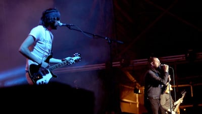 Sergio Pizzorno, left, and Tom Meighan, of Kasabian perform on stage at Blended 2015 at Media City Amphitheatrein Dubai. Satish Kumar / The National