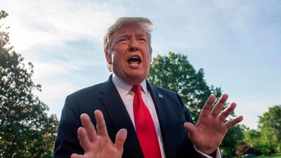 US President Donald Trump speaks with reporters as he departs the White House. AFP
