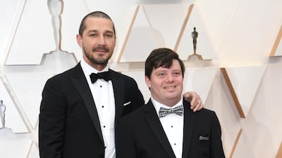 Shia LaBeouf and Zack Gottsagen arrive at the Oscars on Sunday, February 9, 2020, at the Dolby Theatre in Los Angeles. AP