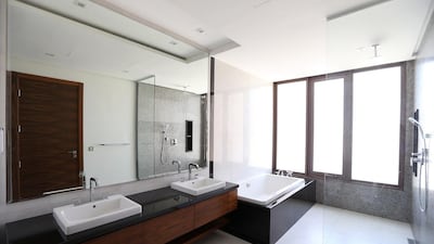 The bathroom in the type 8 four bedroom villa. Measuring 4,725 square feet on a 6,780 square foot plot it includes a reasonably sized garden and a barbecue deck. The bedrooms are all en-suite with a sizeable rain shower and wet room in the master bathroom and all the bedrooms include large built in cupboards. Pawan Singh / The National