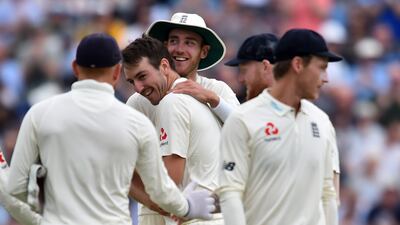Toby Roland-Jones, centre, is the first player since Graham Onions in 2009 to take five or more wickets in a debut Test innings. Glyn Kirk / AFP