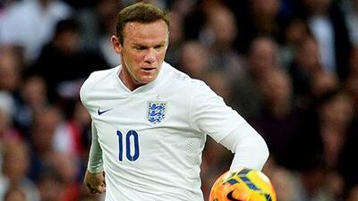 Wayne Rooney will lead England in two internationals next month. Andy Rain / EPA
