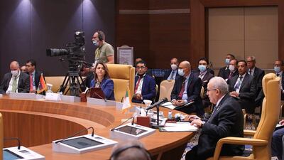 Algeria's Foreign Minister Ramtane Lamamra, right, and Libya's Foreign Minister Najla Al Mangoush, centre, attend a ministerial meeting of Libya's neighbouring countries in Algiers, Algeria. EPA
