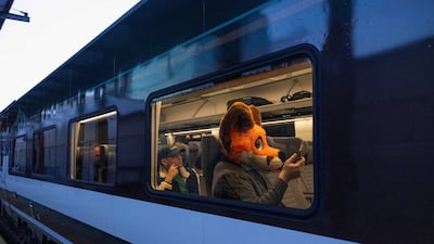 Travel blogger Foxpresso in character aboard Amtrak Cascades train 503 on the first day of service for Amtrak's new Airo trainsets in Seattle. Reuters