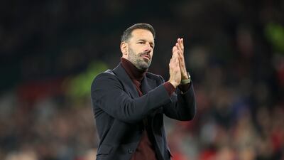 Manchester United interim manager Ruud van Nistelrooy applauds the Old Trafford crowd following the match against Chelsea. EPA