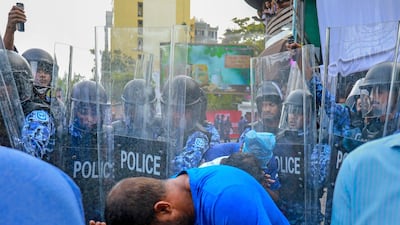 Policemen use pepper spray to disperse opposition supporters during a protest in the Maldivian capital Male on February 16, 2018. Mohamed Sharuhan / AP Photo