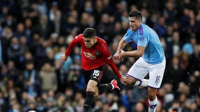 Manchester City's Rodri with Manchester United's Andreas Pereira. Reuters