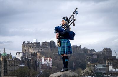 Scotland's national piper Louise Marshall plays her 95-year-old Robertson bagpipe at the top of Calton Hill, Edinburgh, ahead of International Bagpipe Day last year. Photo: Jane Barlow