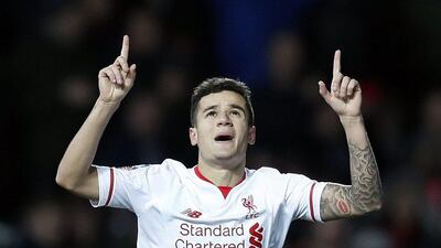Philippe Coutinho celebrates after scoring the first goal for Liverpool. (Reuters/Eddie Keogh)