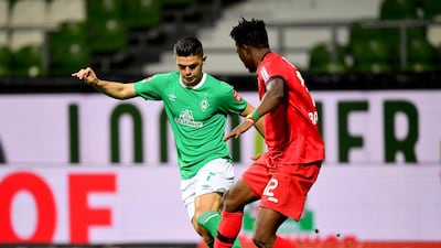 Bayer Leverkusen's Edmond Tapsoba in action with Werder Bremen's Milot Rashica. Reuters