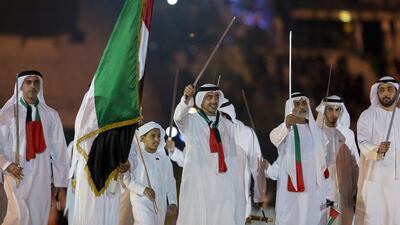 Lt Gen Sheikh Saif bin Zayed, Deputy Prime Minister and Minister of Interior (L), Sheikh Abdullah bin Zayed, Minister of Foreign Affairs (C), Sheikh Nahyan bin Mubarak, Minister of Culture Youth and Community Development (3rd R), and Sheikh Rashid bin Saud, Crown Prince of Umm Al Quwain (R), dance during the 44th UAE National Day celebrations at Zayed Sports City. Philip Cheung / Crown Prince Court - Abu Dhabi