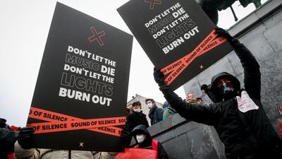 People gather during a demonstration of the cultural sector against the closure of venues under new rules put into place against Covid-19, in Brussels, Belgium. EPA