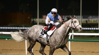 Solow, ridden by jockey Maxime Guyon, won the Dubai Turf at the Meydan Racecourse in Dubai in March. Pawan Singh / The National