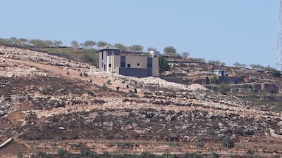 Israeli army soldiers near a Palestinian house which was besieged by Israeli settlers in Qusra village in the occupied West Bank August 13,2026. Reuters
