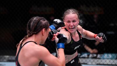 Valentina Shevchenko of Kyrgyzstan, right, punches Jennifer Maia of Brazil in their women's flyweight championship bout during the UFC 255 event at UFC APEX on November 21, 2020 in Las Vegas, Nevada. Jeff Bottari / Zuffa LLC / Getty Images