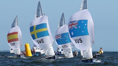 Mathew Belcher and Will Ryan of Australia (R) on their way to win gold in the Men's Two Person Dinghy medal race.