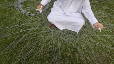 A local fisherman shows how nets are mended, as part of the event