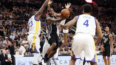 San Antonio Spurs small forward Kawhi Leonard (2) drives to the basket under pressure from Golden State Warriors power forward Draymond Green (23) and center Marreese Speights (5, behind) during the first half at AT&T Center. Soobum Im-USA TODAY Sports