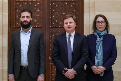 Ahmed Al Shara, head of Hayat Tahrir Al Sham, the de facto new leaders of Syria, meets Stephen Hickey, director of the Middle East and North Africa department at Britain's Foreign Office, in Damascus on Tuesday. AFP