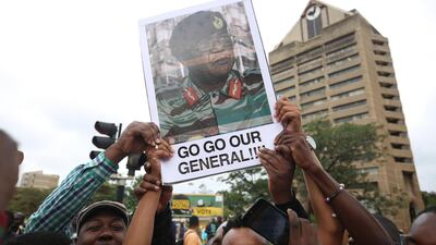 People take part in a march along the city's streets, heading for a solidarity rally, on the removal of Zimbabwean president Robert Mugabe, at the Zimbabwe Grounds in Highfield, Harare. Aaron Ufumeli / EPA