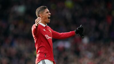 Manchester United's Raphael Varane celebrates with the Old Trafford crowd after the final whistle. PA