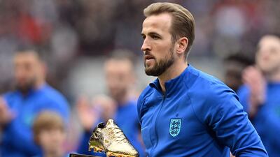Harry Kane after receiving a trophy for becoming England's record goalscorer ahead of the Euro 2024 win over Ukraine at Wembley Stadium, on March 26, 2023. AFP