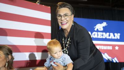 Ms Hageman poses with a child at the event. AFP