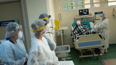 Covid-19 patient Celso da Silva Costa, 76, receives a visit from his wife Tania Lucia Mauricio at the Ronaldo Gazolla Hospital in Rio de Janeiro, Brazil. The Ronaldo Gazolla Hospital allows vaccinated family members to visit their loved ones, an indication that vaccination rates are beginning to climb in the state and a glimmer of hope for residents after more than a year of pandemic restrictions. AP Photo