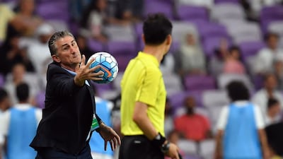 Manager Edgardo Bauza, left, is busy on the touchline during the UAE's Word Cup qualifying win over Saudi Arabia at Hazza bin Zayed Stadium on Tuesday. Giuseppe Cacace / AFP