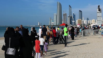 Visitors attend the final day of the Mother of the Nation Festival along the Corniche in Abu Dhabi.