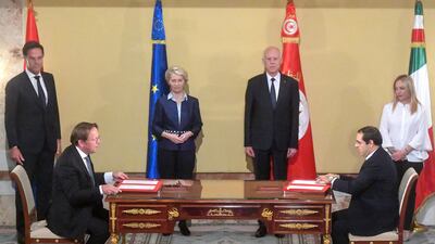 Netherlands Prime Minister Mark Rutte, European Commission President Ursula Von der Leyen, Tunisian President Kais Saied and Italy's Prime Minister Giorgia Meloni watch the preliminary agreement signing in Tunis on July 16. AFP