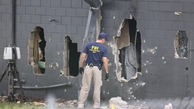 FBI agents investigate the damaged rear wall of the Pulse Nightclub where Omar Mateen killed 49 people on June 12, 2016 in Orlando, Florida. Joe Raedle / Getty Images /