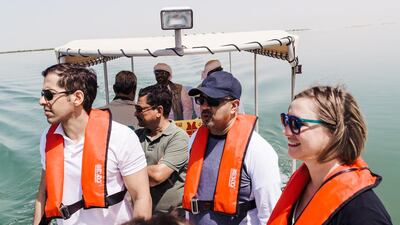 From left: Mohammed Al Otaiba, The National’s Editor-in-Chief, Arif Lalani, Canada’s ambassador to the UAE, and Laura Koot, The National’s Managing Editor, on a boat tour of the mangroves.
