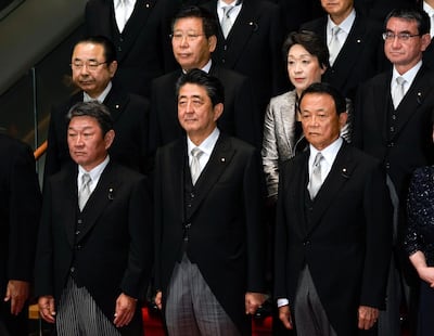 Shinzo Abe has managed to overcome many political challenges even as his cabinet has attracted controversy from time to time. Kimmasa Mayama / EPA