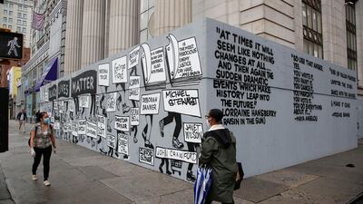 People walk past a mural in Union Square highlighting police brutality nationwide in New York. EPA