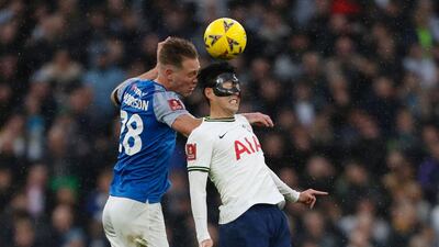 Portsmouth defender Michael Morrison battles with Tottenham striker Son Heung-Min. AFP