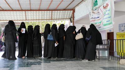 Women queue for food vouchers at a World Food Programme food aid distribution centre in Sanaa, Yemen's rebel-held capital, on February 11, 2020. Reuters